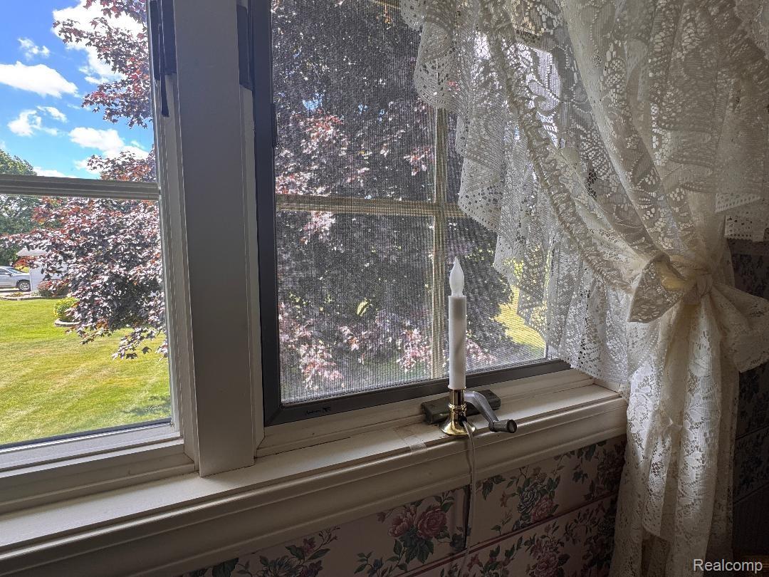 6686 South Schott Road Mayville, MI 48744 - Photo 14 of 25 Double-hung window with white casing and a window screen