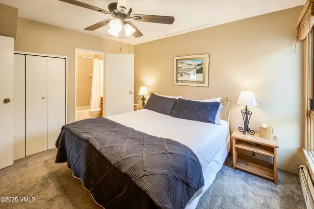 a bedroom with bed and window