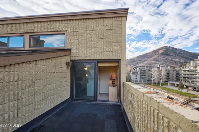 a view of a living room with a large window