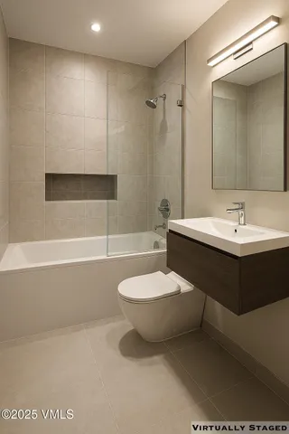 a kitchen with stainless steel appliances a microwave a stove and cabinets