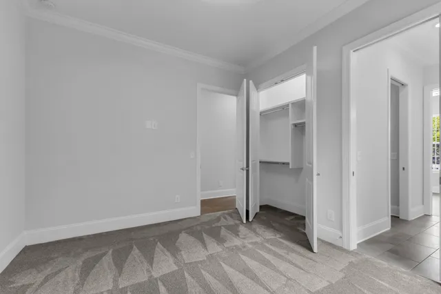 a view of room with window and ceiling fan