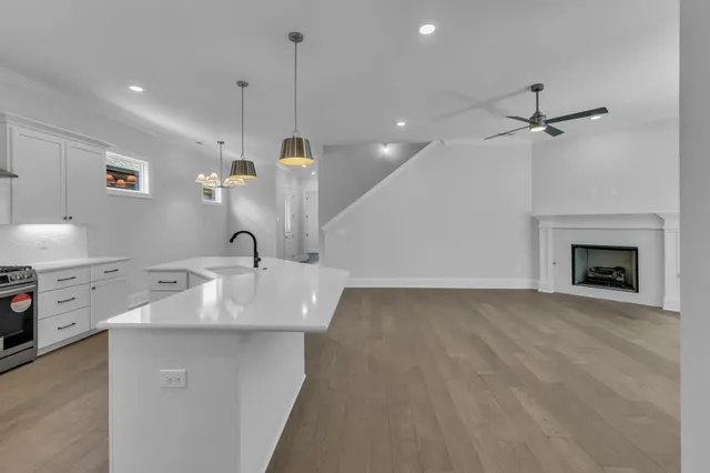 a view of a bathroom with a sink mirror and toilet