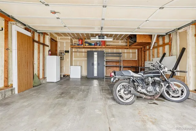 a view of a patio with table and chairs and potted plants