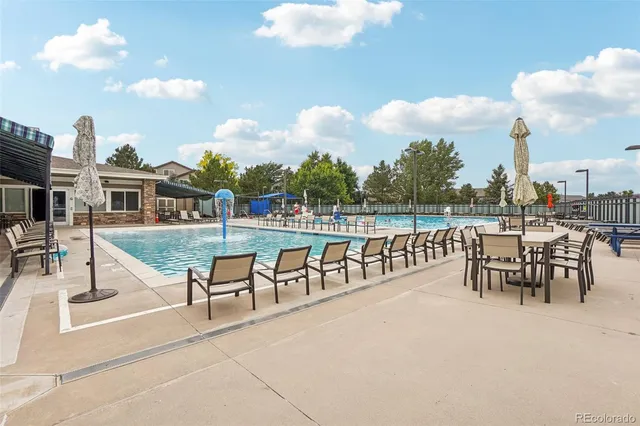 a view of outdoor space with playground and green space