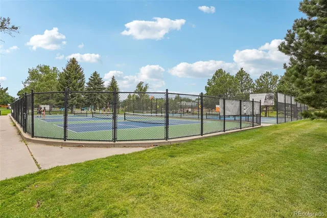 a view of a lake with houses in the background