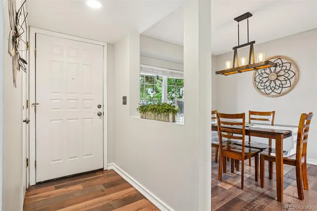 a view of room with furniture and wooden floor