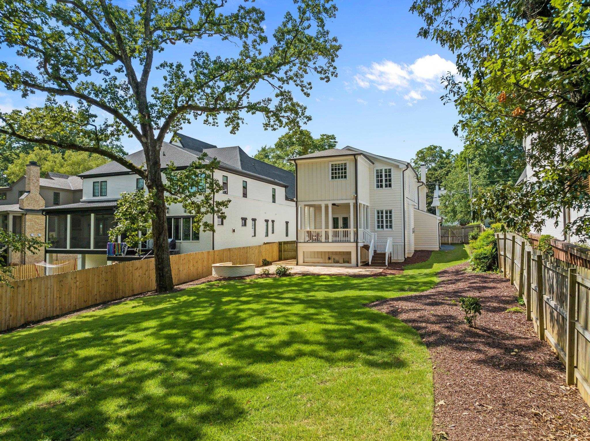 2116 Cowper Drive Raleigh, NC 27608 - Photo 10 of 65 A rare large and flat backyard provides privacy and inspires the imagination. Large Backyard