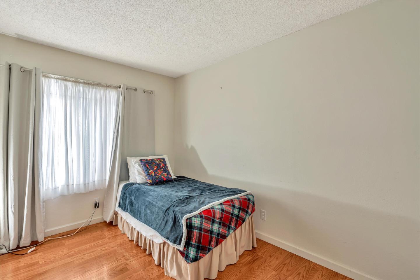188 Masonic Drive Vallejo, CA 94591 - Photo 17 of 28 a bedroom with a bed and window