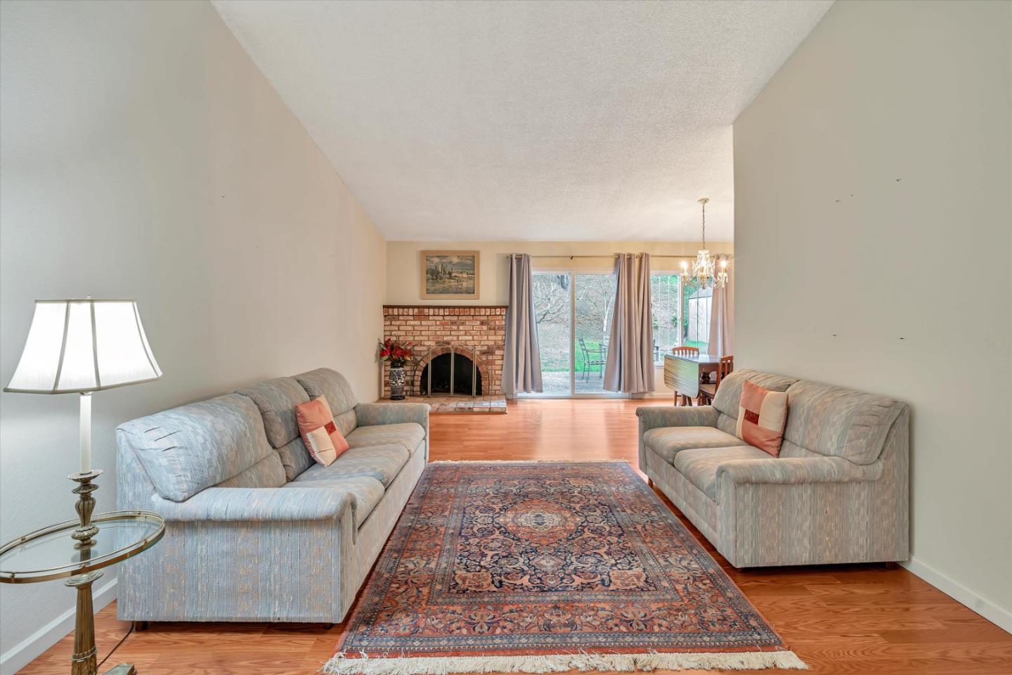 188 Masonic Drive Vallejo, CA 94591 - Photo 4 of 28 a living room with furniture a rug and a fireplace