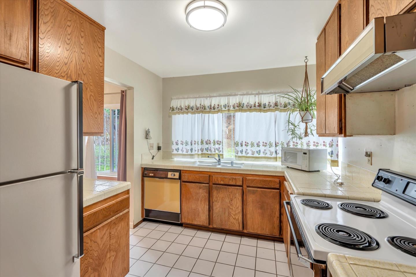 188 Masonic Drive Vallejo, CA 94591 - Photo 7 of 28 a kitchen with a sink appliances and cabinets