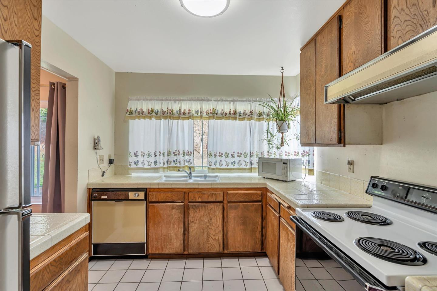 188 Masonic Drive Vallejo, CA 94591 - Photo 9 of 28 a kitchen with a sink stove top oven and cabinets