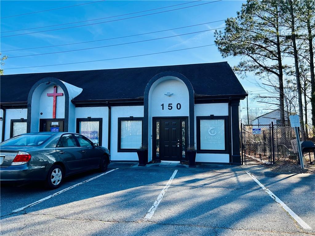 3982 Cherokee Trail Suwanee, GA 30024 - Photo 2 of 11 a front view of a house with a garden