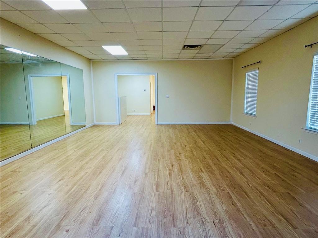 3982 Cherokee Trail Suwanee, GA 30024 - Photo 4 of 11 a view of empty room with wooden floor