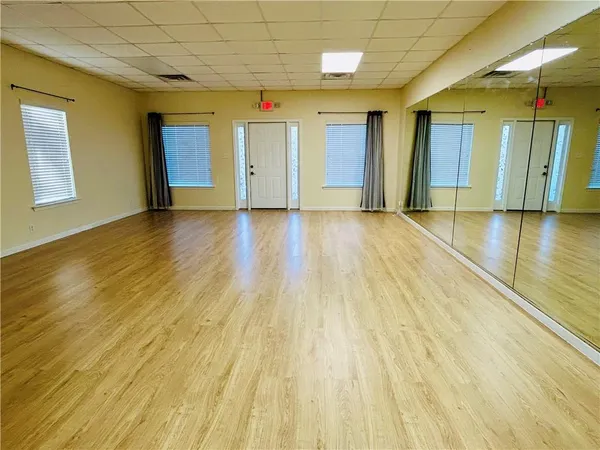 a view of a livingroom with wooden floor