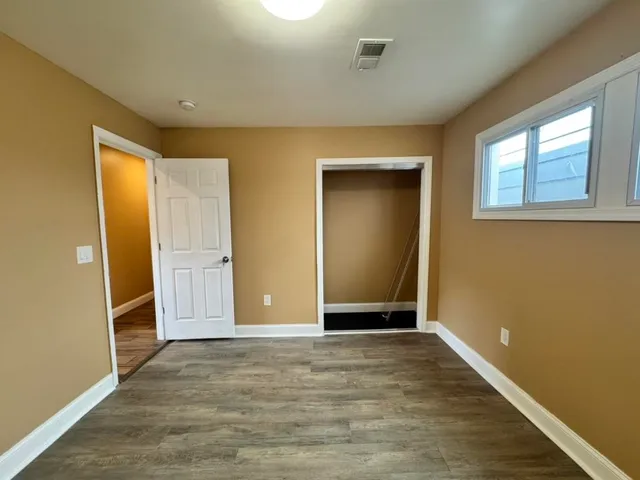 a bathroom with a tub and shower