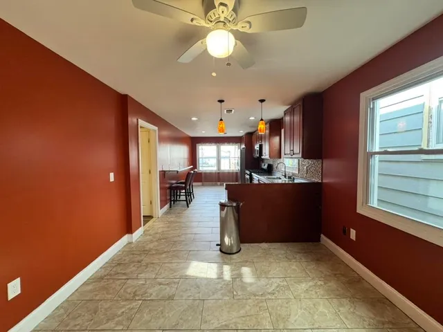 a kitchen with stainless steel appliances granite countertop a sink counter space cabinets and a counter top space