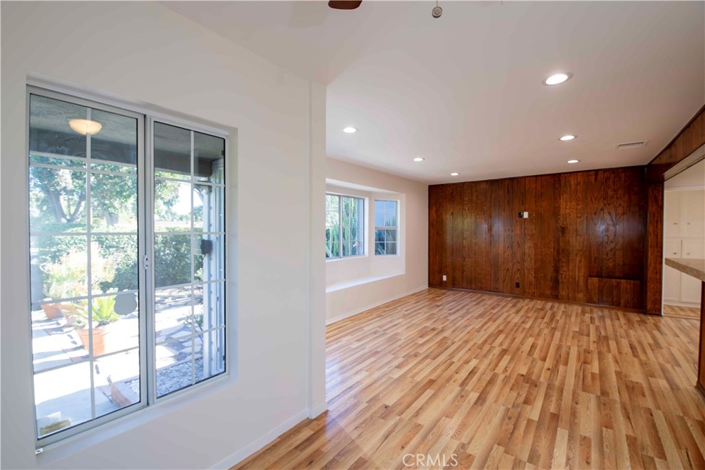6417 White Oak Avenue Reseda, CA 91335 - Photo 13 of 50 a view of an empty room with wooden floor and windows