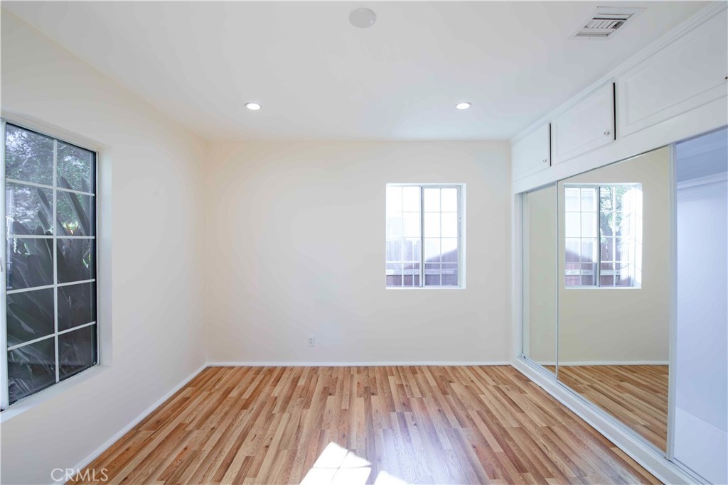 6417 White Oak Avenue Reseda, CA 91335 - Photo 17 of 50 a view of an empty room with wooden floor and a window