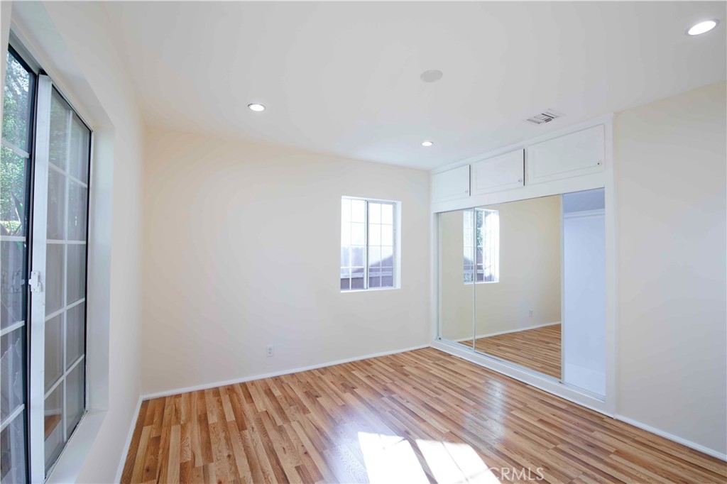 6417 White Oak Avenue Reseda, CA 91335 - Photo 18 of 50 a view of a room with wooden floor and window