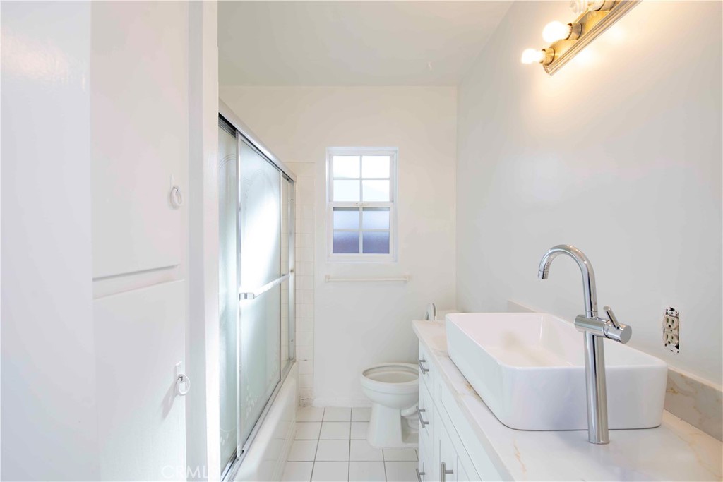 6417 White Oak Avenue Reseda, CA 91335 - Photo 21 of 50 a bathroom with a sink a toilet and shower