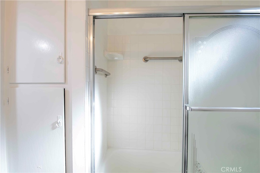 6417 White Oak Avenue Reseda, CA 91335 - Photo 23 of 50 a bathroom with a glass shower door
