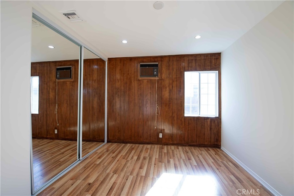 6417 White Oak Avenue Reseda, CA 91335 - Photo 25 of 50 a view of an empty room with wooden floor and a window