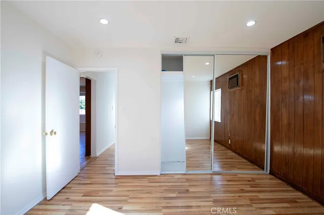 a view of hallway with wooden floor
