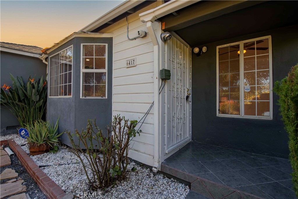 6417 White Oak Avenue Reseda, CA 91335 - Photo 3 of 50 a potted plant sitting in front of a house