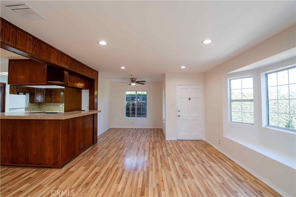 6417 White Oak Avenue Reseda, CA 91335 - Photo 4 of 50 a view of an empty room with a window and wooden floor