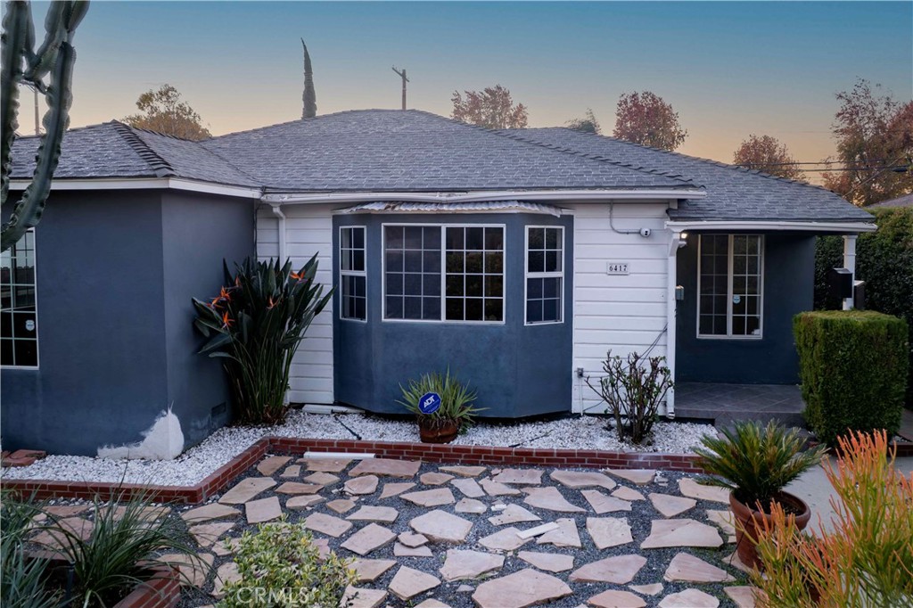 6417 White Oak Avenue Reseda, CA 91335 - Photo 49 of 50 a front view of a house with potted plants