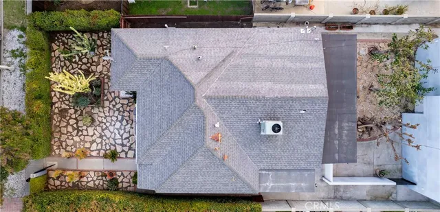 an aerial view of a residential houses with outdoor space