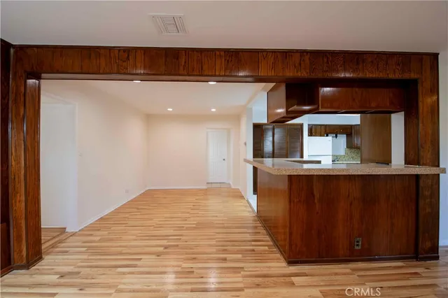 a view of kitchen with wooden floor and staircase