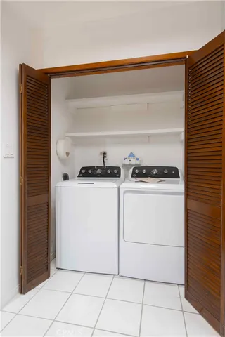 a utility room with washer and dryer