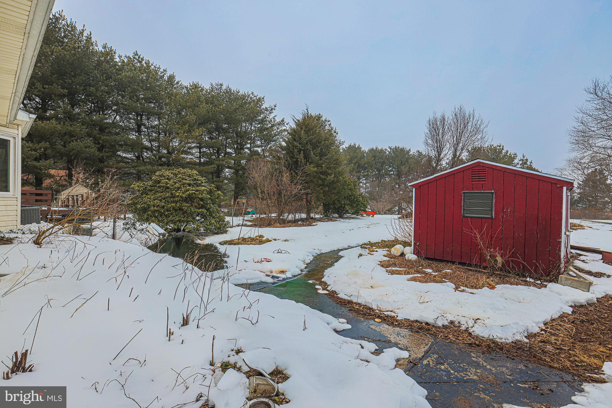 31 Blake Road Elkton, MD 21921 - Photo 49 of 54 Charming winter landscape with a red shed.