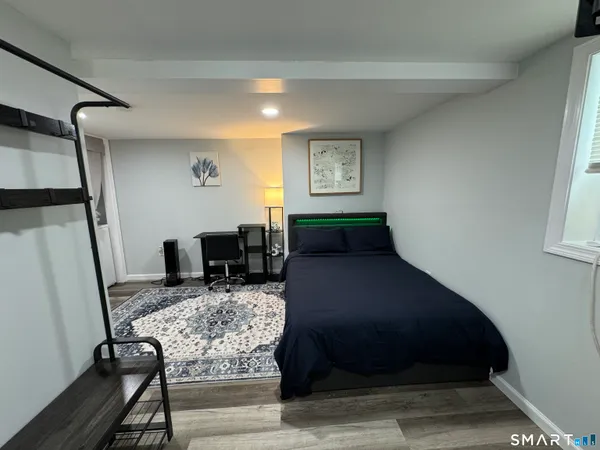 a living room with furniture and a rug