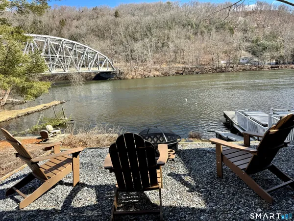 an aerial view of a house with lake view