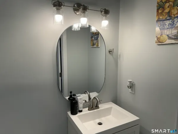 a bathroom with a sink and a mirror