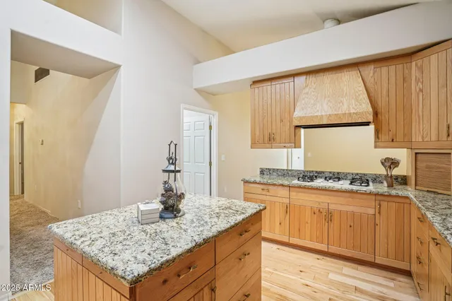 a kitchen with sink stove and refrigerator