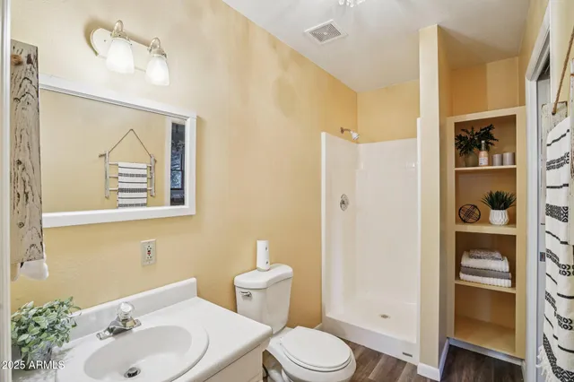 a view of a room with air conditioner duct and materials on floor