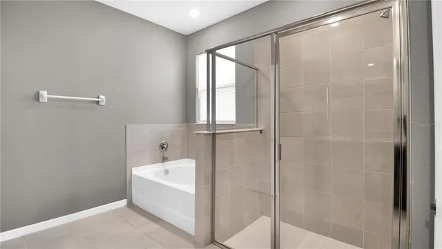 a bathroom with a bathtub and shower