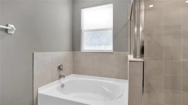 a bathroom with a bathtub and a sink