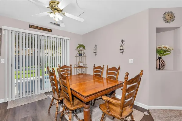 a dining room with furniture and window