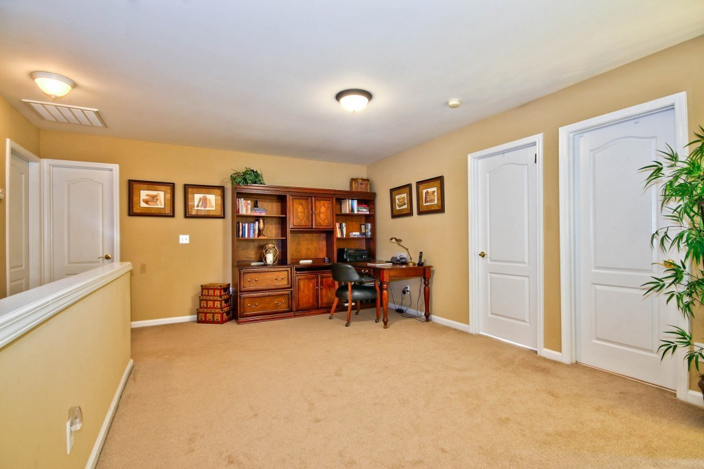 7725 Monte Alto Drive Raleigh, NC 27613 - Photo 14 of 25 This space is a great size! Loft area currently used as an office, it can be whatever you need it to be. This home also features a finished walk in attic and so much storage throughout the home. Loft