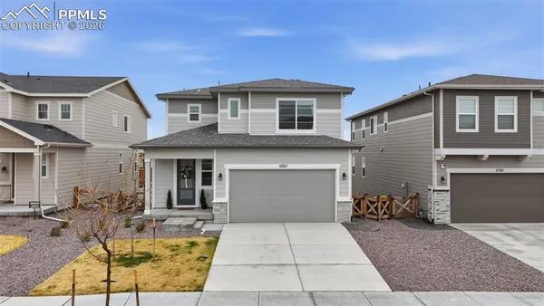 a view of house with yard outdoor seating and entertaining space