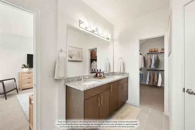 a bathroom with a sink vanity and mirror
