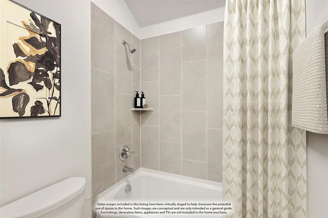 a bathroom with a shower curtain