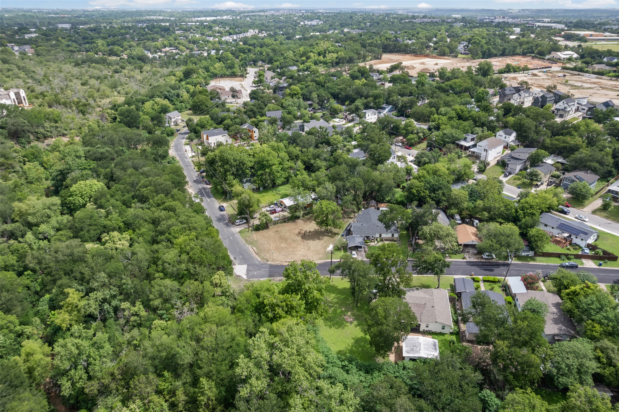 1201 Fort Branch Boulevard Austin, TX 78721 - Photo 11 of 19 An aerial panorama reveals verdant surroundings and a tranquil neighborhood street.