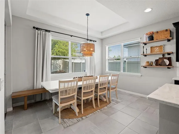 a spacious bedroom with a bed and a couch