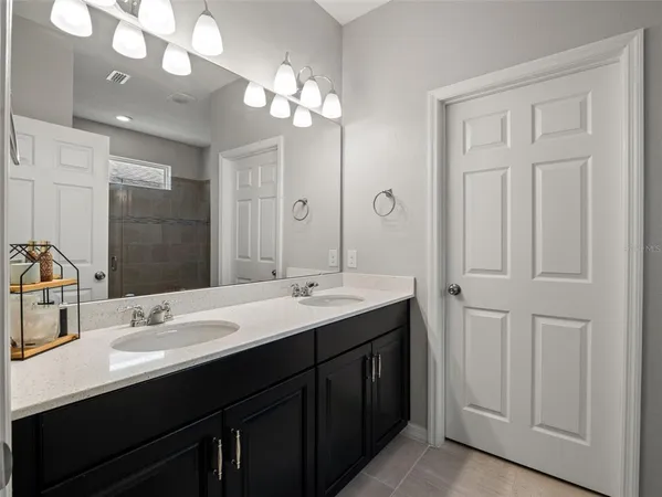 a bedroom with furniture and a large window