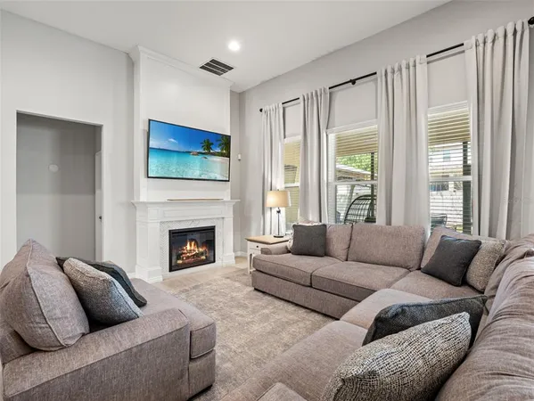 a large kitchen with a table and chairs in it